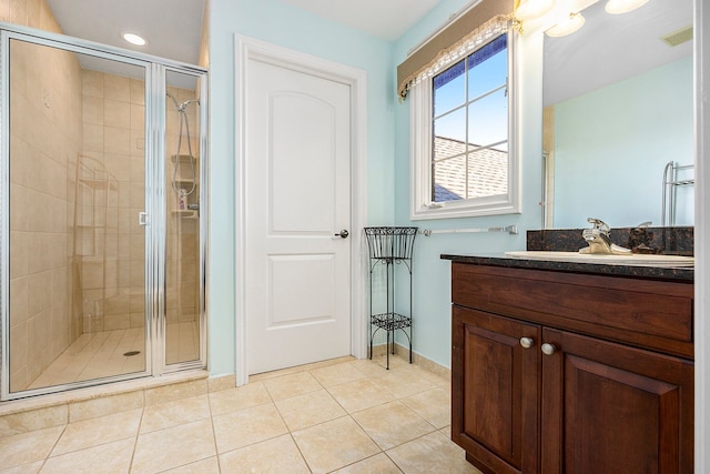 2434 Pebble Beach Dr, Oakland, MI 48363 - full bath featuring vanity, baseboards, tile patterned flooring, a shower stall, and visible vents