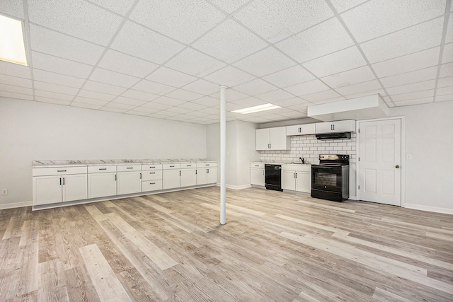 2434 Pebble Beach Dr, Oakland, MI 48363 - below grade area with a sink, light wood-type flooring, baseboards, and a drop ceiling