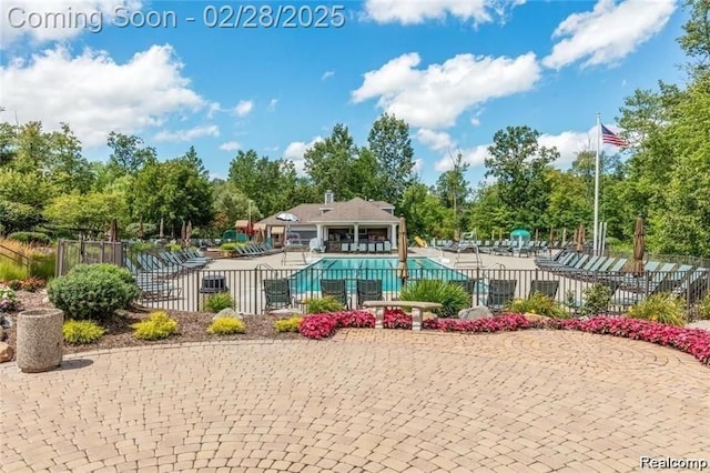 2434 Pebble Beach Dr, Oakland, MI 48363 - pool featuring a patio area and fence