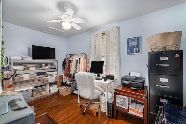 office space with a ceiling fan, attic access, and wood finished floors