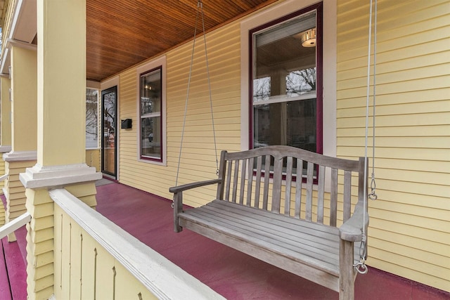 wooden terrace with a porch