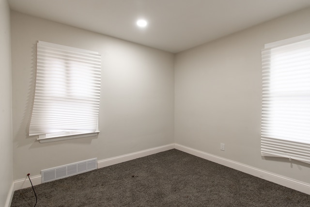 9661 Asbury Park, Detroit, MI 48227 - spare room with baseboards, dark colored carpet, visible vents, and recessed lighting
