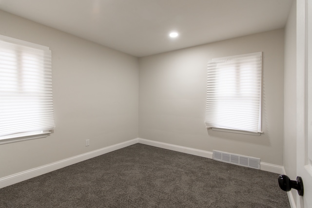 9661 Asbury Park, Detroit, MI 48227 - spare room with visible vents, baseboards, recessed lighting, and dark colored carpet