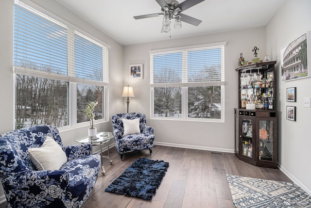 4117 Avery Rd, Lake Orion, MI 48359 - living area featuring baseboards, a ceiling fan, a wealth of natural light, and hardwood / wood-style flooring