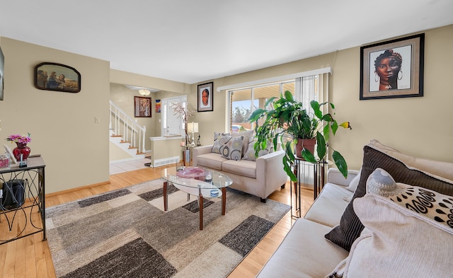 11151 Brougham Dr, Sterling Heights, MI 48312 - living room with baseboards, stairway, and wood finished floors