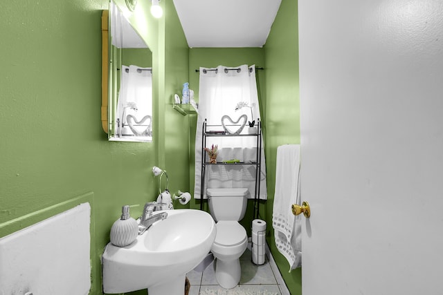 11151 Brougham Dr, Sterling Heights, MI 48312 - bathroom featuring tile patterned floors, a sink, and toilet