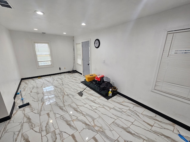 494 Polk Ave, River Rouge, MI 48218 - unfurnished room with recessed lighting, visible vents, marble finish floor, and baseboards