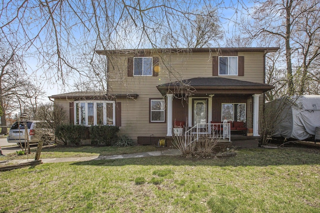 traditional-style home featuring covered porch and a front yard