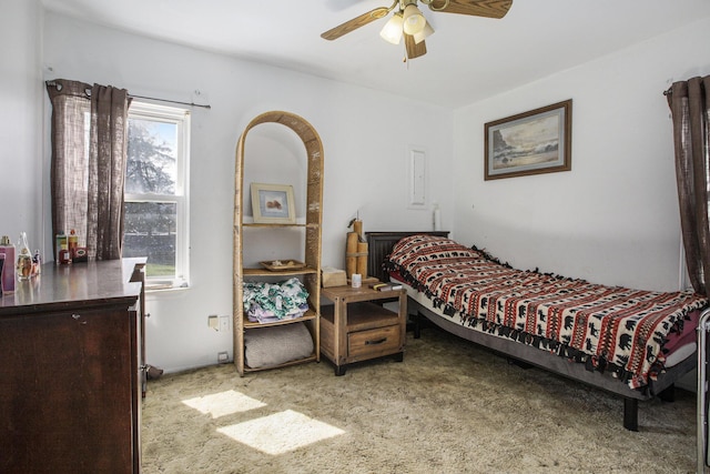 carpeted bedroom featuring a ceiling fan