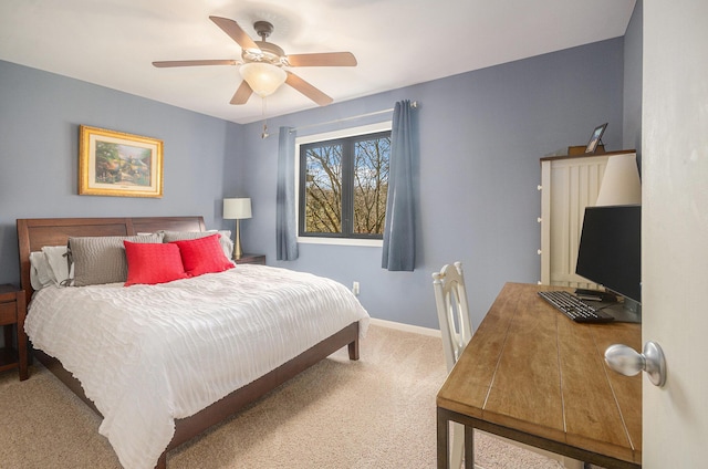 carpeted bedroom featuring baseboards and a ceiling fan