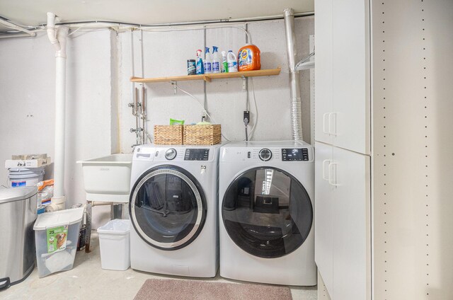 washroom with laundry area and washing machine and clothes dryer