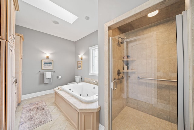full bathroom with a shower stall, tile patterned flooring, a jetted tub, and a skylight