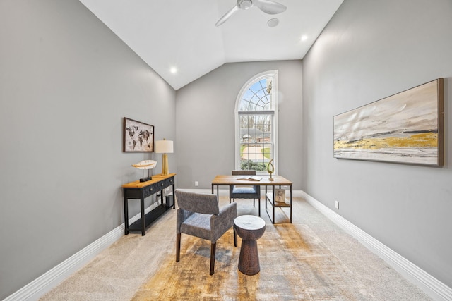 dining space featuring ceiling fan, vaulted ceiling, baseboards, and light carpet