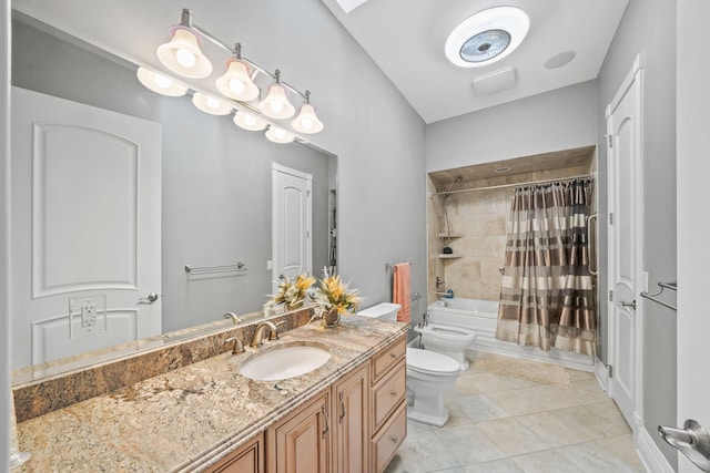 bathroom with tile patterned floors, vanity, toilet, shower / tub combo, and a bidet