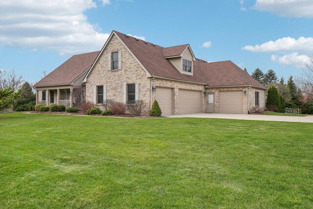 new england style home featuring driveway, a garage, and a front yard
