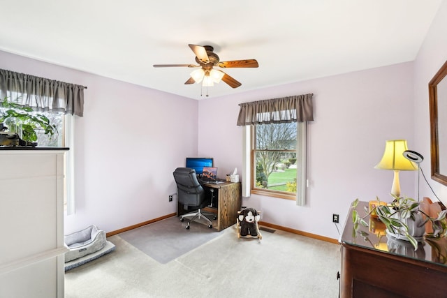 carpeted office featuring ceiling fan, baseboards, and visible vents
