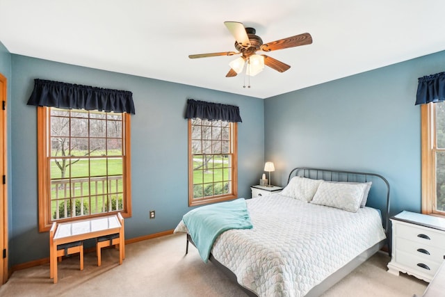 bedroom with baseboards, carpet flooring, and ceiling fan