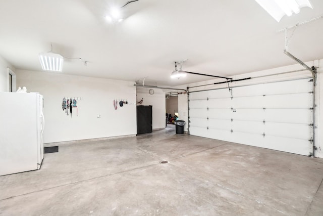 garage with freestanding refrigerator