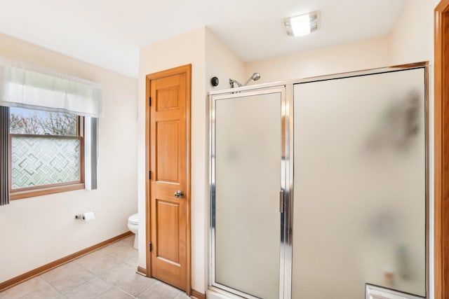 bathroom featuring baseboards, a stall shower, tile patterned floors, toilet, and visible vents