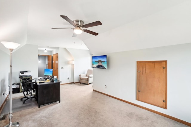 home office featuring baseboards, carpet flooring, ceiling fan, and vaulted ceiling