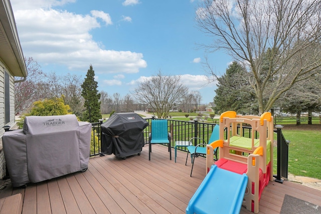 deck with a yard and grilling area