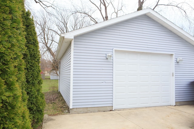 detached garage featuring driveway