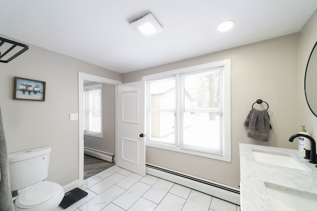 bathroom with toilet, a baseboard radiator, marble finish floor, and a sink