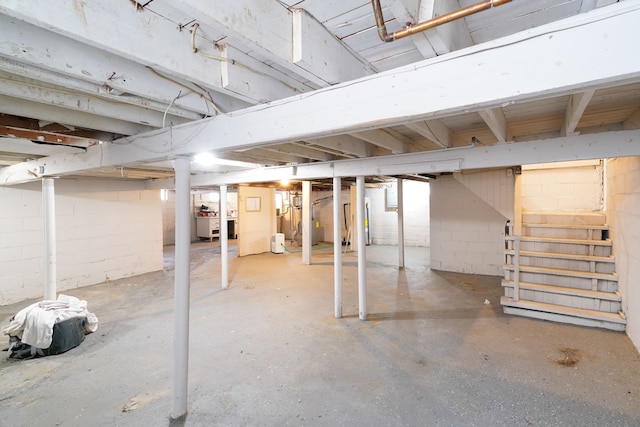unfinished below grade area featuring stairway