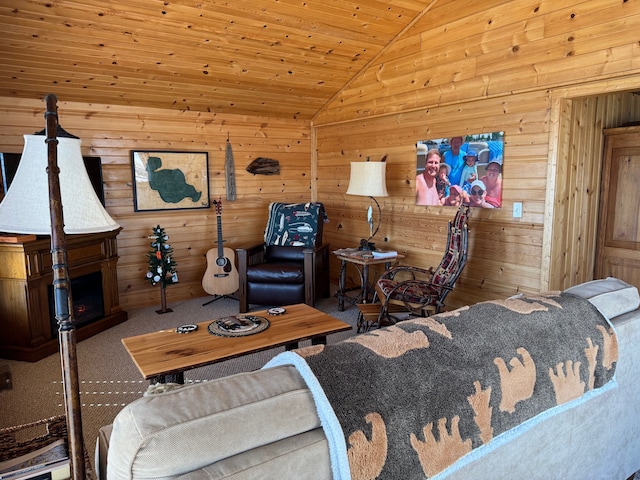 living area with lofted ceiling, carpet, and wooden walls