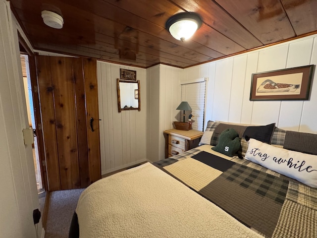bedroom featuring carpet flooring and wooden ceiling