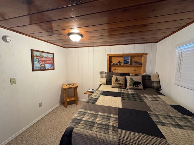 bedroom with wooden ceiling, light colored carpet, and baseboards
