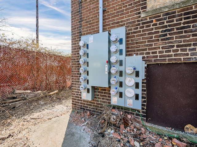 11765 Glenfield St, Detroit, MI 48213 - exterior details featuring electric meter, brick siding, and fence