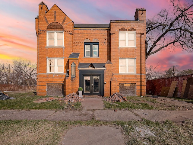 11765 Glenfield St, Detroit, MI 48213 - view of front of property featuring a chimney, french doors, and brick siding