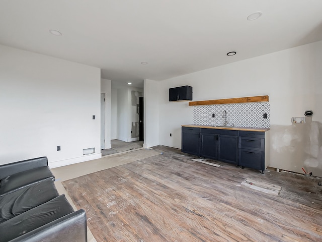 11765 Glenfield St, Detroit, MI 48213 - unfurnished living room featuring light wood finished floors and recessed lighting