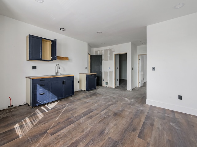 11765 Glenfield St, Detroit, MI 48213 - kitchen featuring dark wood-style flooring, blue cabinetry, and a sink