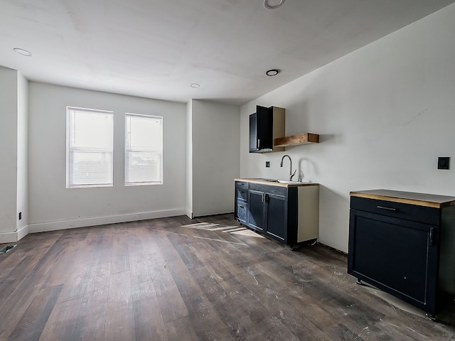 11765 Glenfield St, Detroit, MI 48213 - kitchen with dark cabinets, dark wood-type flooring, baseboards, and a sink