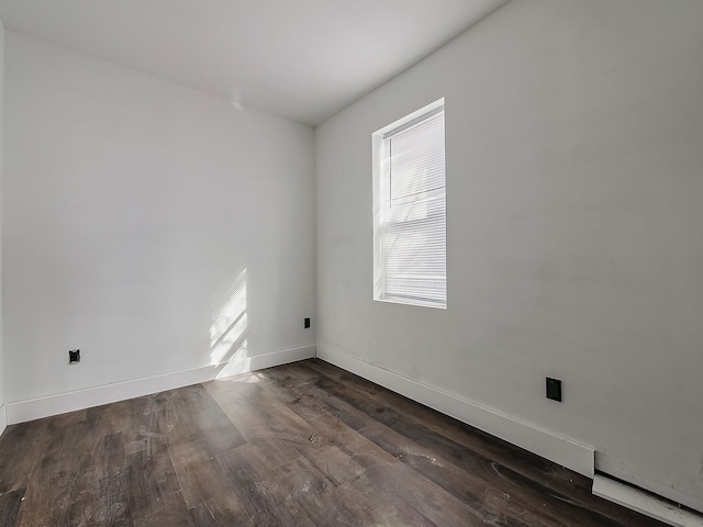 11765 Glenfield St, Detroit, MI 48213 - spare room with baseboards and dark wood finished floors