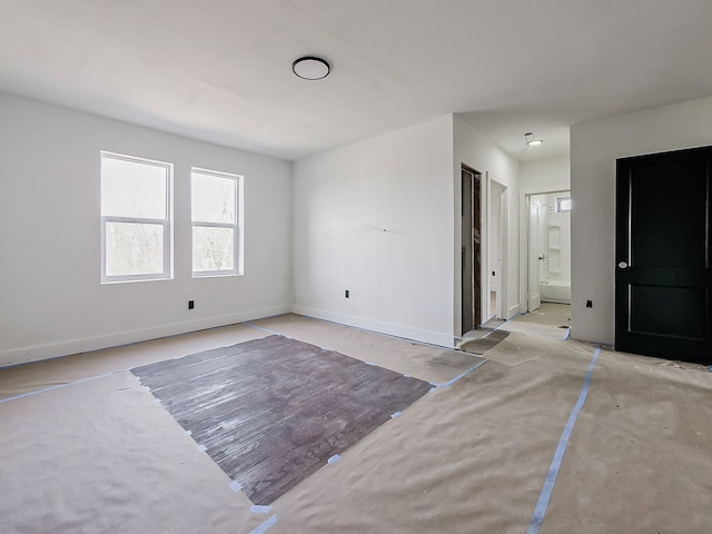 11765 Glenfield St, Detroit, MI 48213 - unfurnished living room featuring baseboards and concrete flooring