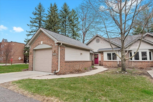 21304 Juniper Ct Unit 69, Farmington Hills, MI 48336 - view of front facade featuring brick siding, driveway, a garage, and a front lawn