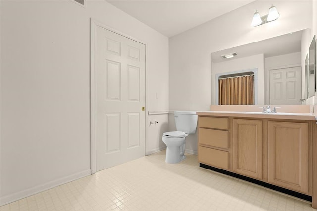 21304 Juniper Ct Unit 69, Farmington Hills, MI 48336 - bathroom with tile patterned floors, vanity, toilet, and baseboards