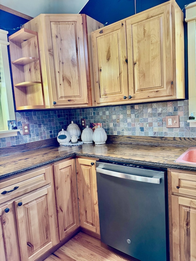 kitchen featuring stainless steel dishwasher, open shelves, backsplash, and light wood-type flooring