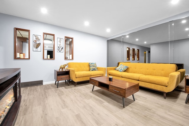 32334 Gloede Dr, Warren, MI 48088 - living area with visible vents, baseboards, light wood-type flooring, and recessed lighting