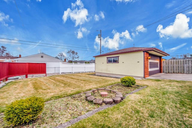 32334 Gloede Dr, Warren, MI 48088 - view of yard with a fenced backyard, a garage, and an outdoor structure