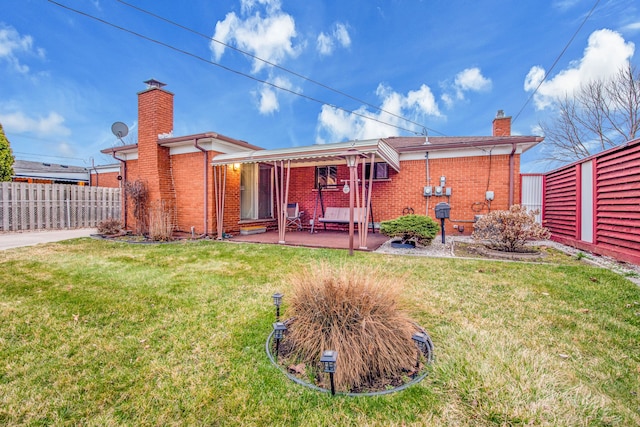 32334 Gloede Dr, Warren, MI 48088 - back of house featuring a patio, a chimney, fence, and brick siding