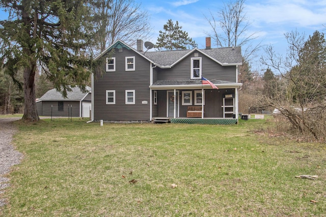 12934 Wilson Rd, Fruitport, MI 49415 - traditional-style home featuring a front yard, a chimney, and covered porch