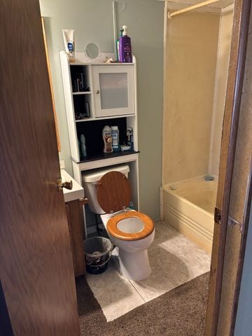 20463 Harmony Dr, Clinton Township, MI 48036 - full bath featuring toilet, vanity, and washtub / shower combination