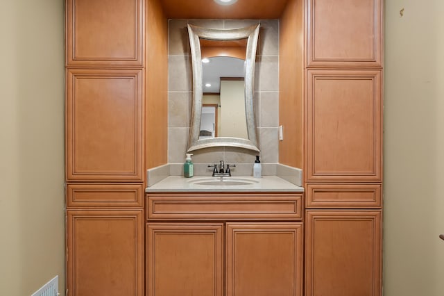bathroom with vanity and visible vents