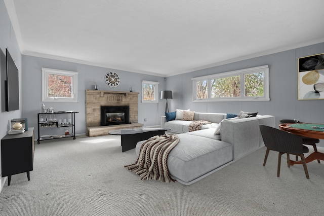 carpeted living room with a fireplace and ornamental molding