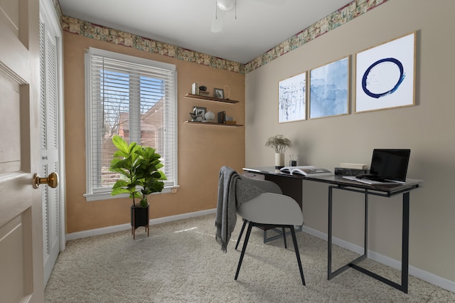 home office featuring baseboards, a ceiling fan, and carpet floors