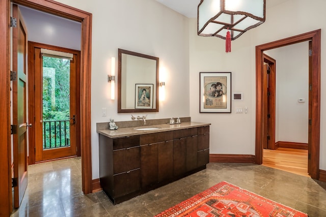 bathroom with baseboards and vanity